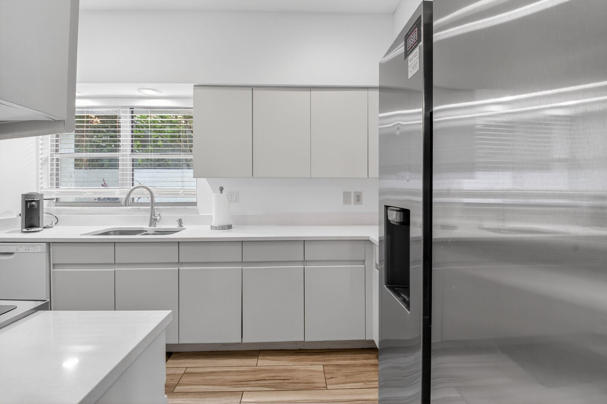 2225 Northwest 53rd Street Boca Raton, FL 33496 - Photo 9 of 46 a kitchen with a sink and a window
