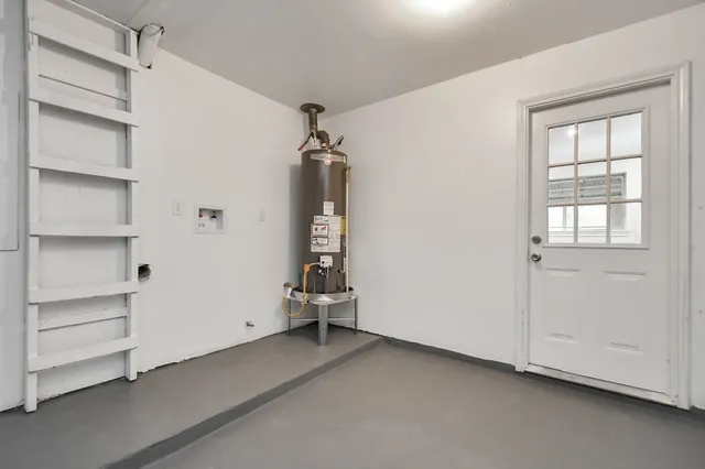 a view of room with cabinet and windows