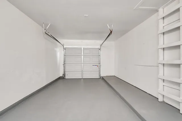 a view of an empty room with white walls
