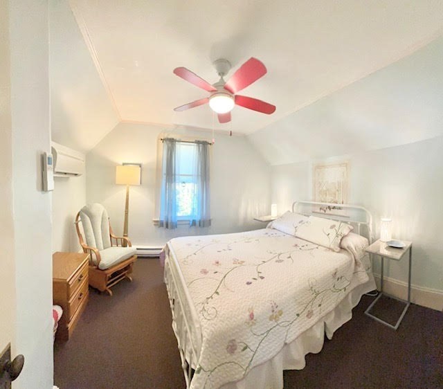 76 Stetson Avenue Swampscott, MA 01907 - Photo 15 of 20 a bedroom with a bed and a chandelier