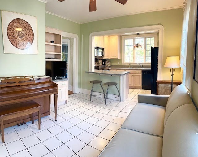 76 Stetson Avenue Swampscott, MA 01907 - Photo 7 of 20 a living room with a couch and a floor to ceiling window