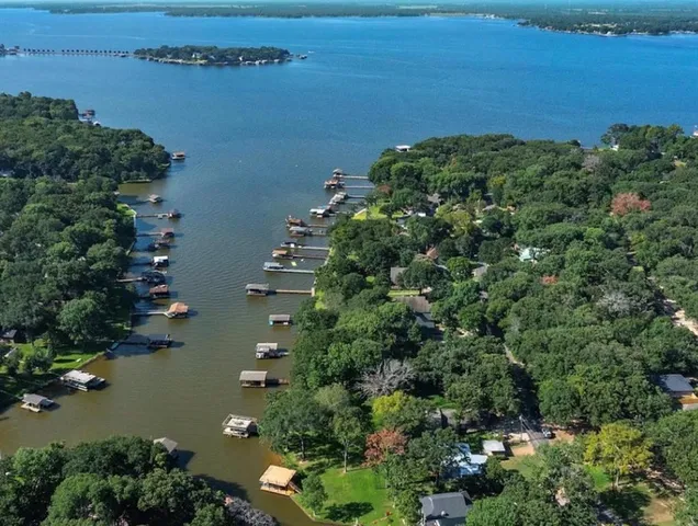 an aerial view of a houses with ocean view