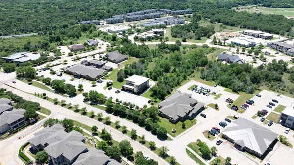 an aerial view of a house with a lake view