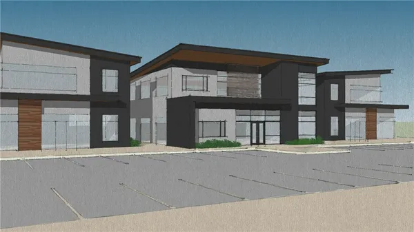 an aerial view of residential houses with outdoor space and street view