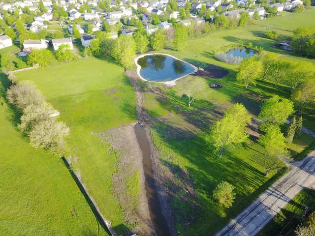 a view of a swimming pool with a yard