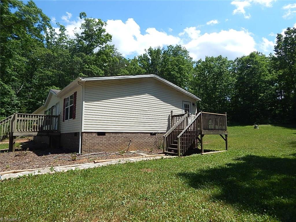 227 Simmons Road Pilot Mountain, NC 27041 - Photo 22 of 27 Enter laundry from side deck.