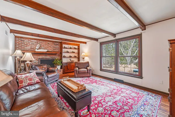 a living room with furniture and a rug