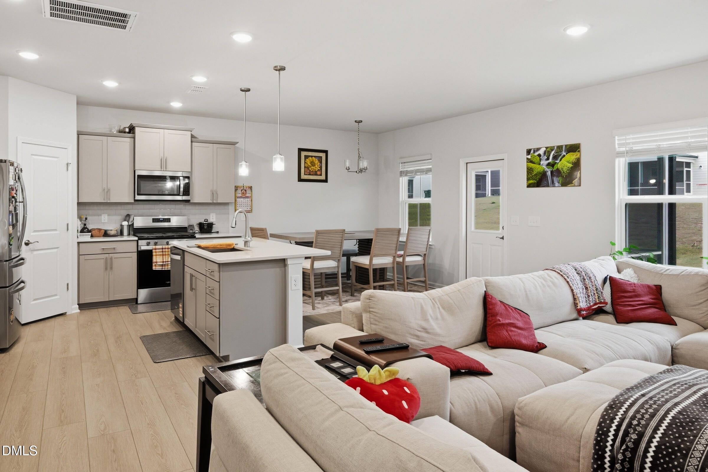 732 Denburn Place Raleigh, NC 27603 - Photo 4 of 12 a living room with furniture and kitchen view