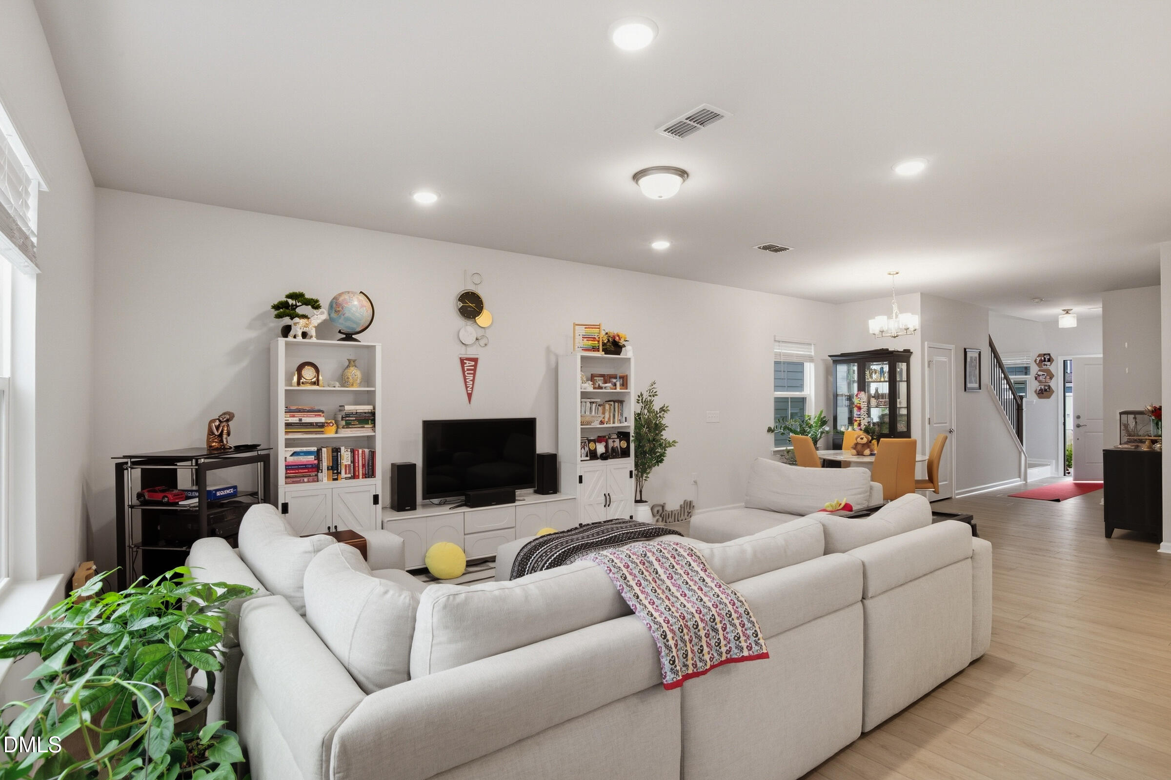 732 Denburn Place Raleigh, NC 27603 - Photo 8 of 12 a living room with furniture and a flat screen tv