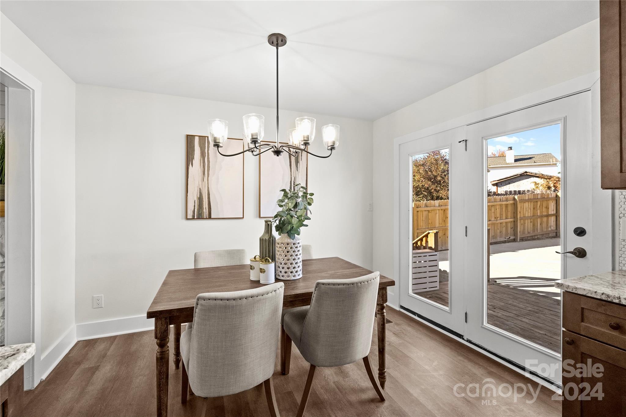 1660 Willowbrook Drive Fort Mill, SC 29708 - Photo 11 of 29 a view of a dining room with furniture window and wooden floor