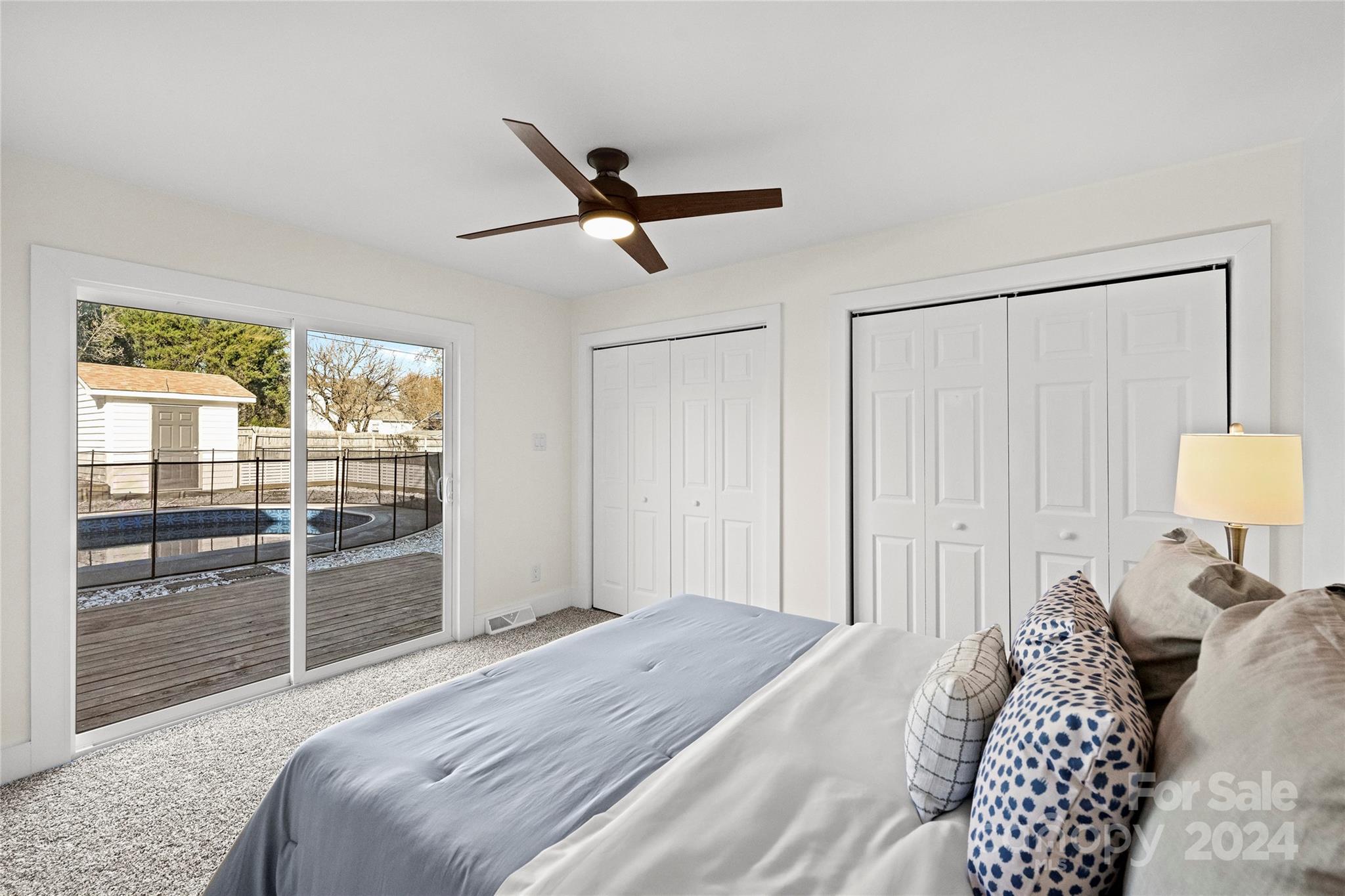 1660 Willowbrook Drive Fort Mill, SC 29708 - Photo 13 of 29 a bedroom with a large bed and a large window