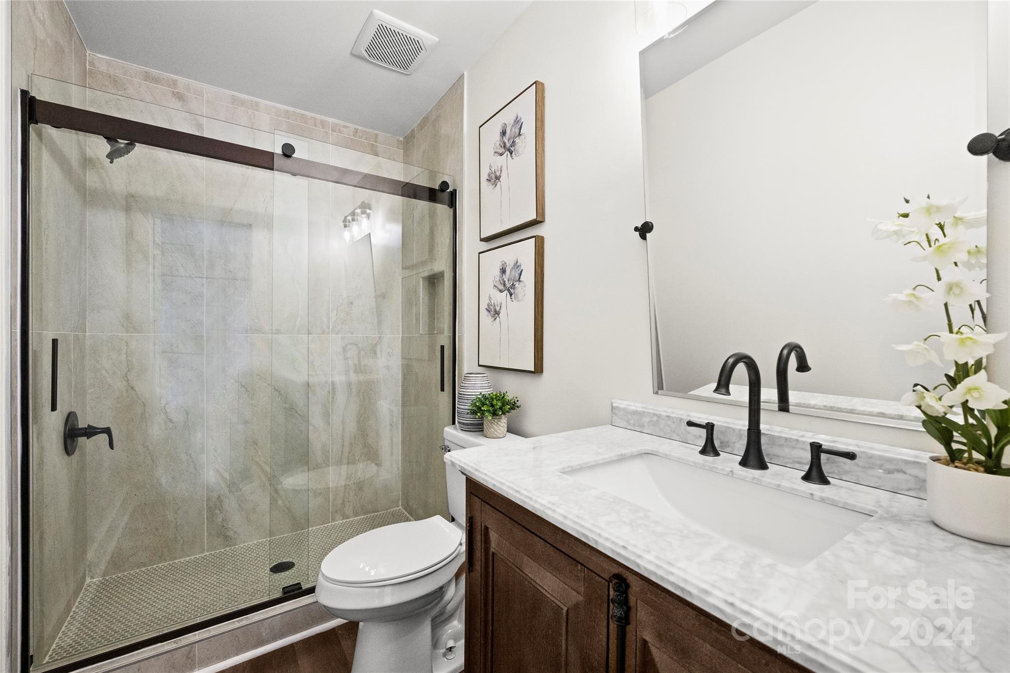 1660 Willowbrook Drive Fort Mill, SC 29708 - Photo 14 of 29 a bathroom with a granite countertop sink toilet and shower