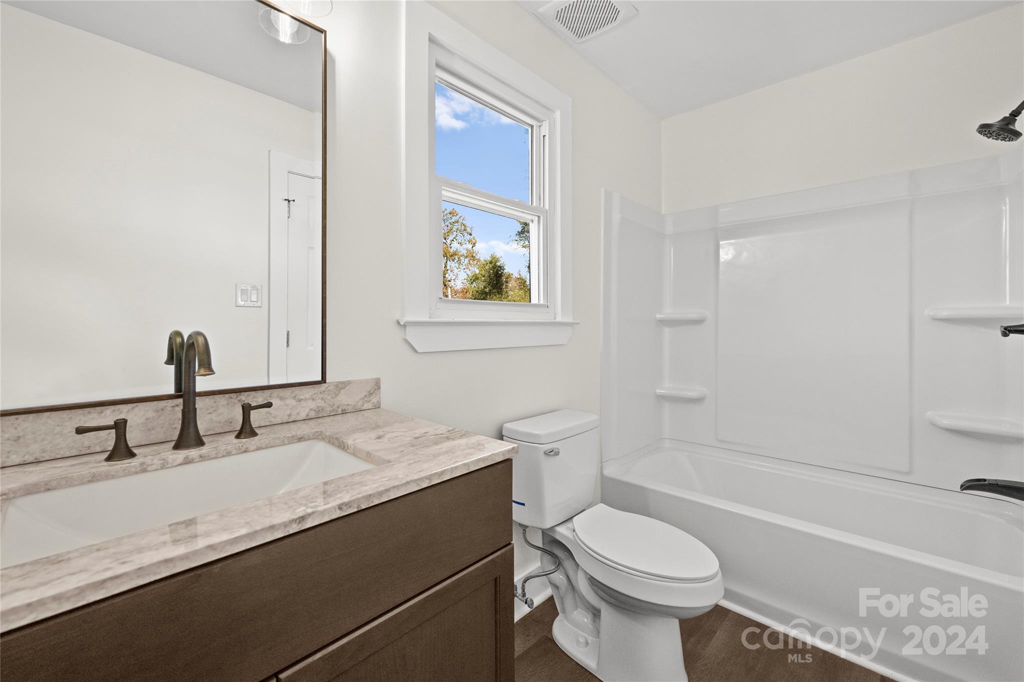1660 Willowbrook Drive Fort Mill, SC 29708 - Photo 20 of 29 a bathroom with a sink toilet vanity and tub