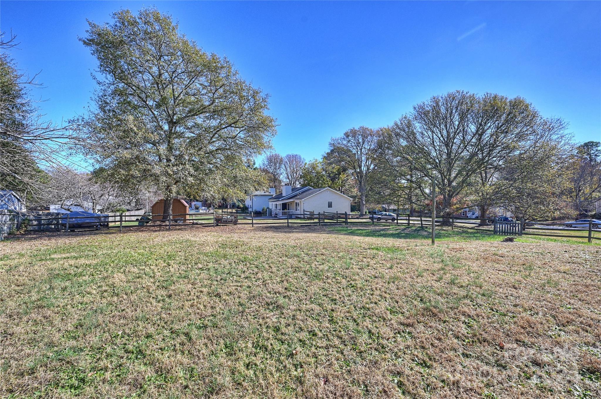 1660 Willowbrook Drive Fort Mill, SC 29708 - Photo 27 of 29 a view of a swimming pool with trees and buildings