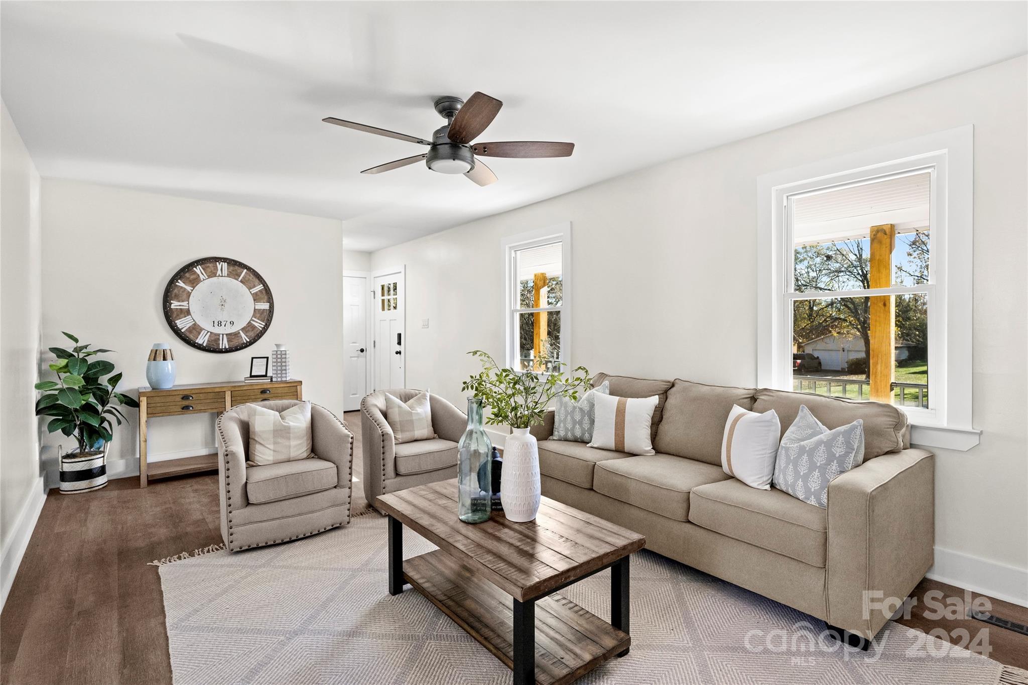 1660 Willowbrook Drive Fort Mill, SC 29708 - Photo 5 of 29 a living room with furniture a clock and a window