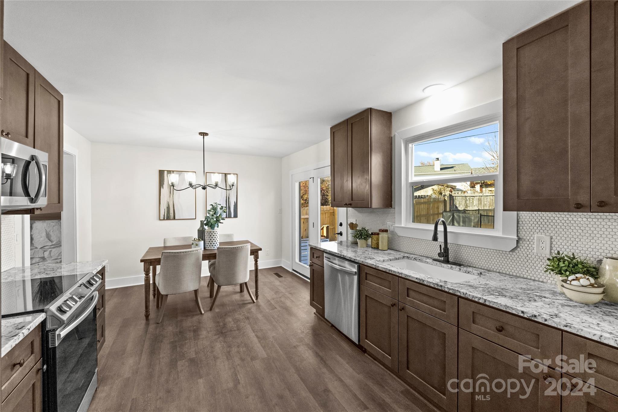 1660 Willowbrook Drive Fort Mill, SC 29708 - Photo 7 of 29 a large kitchen with a table and chairs in it
