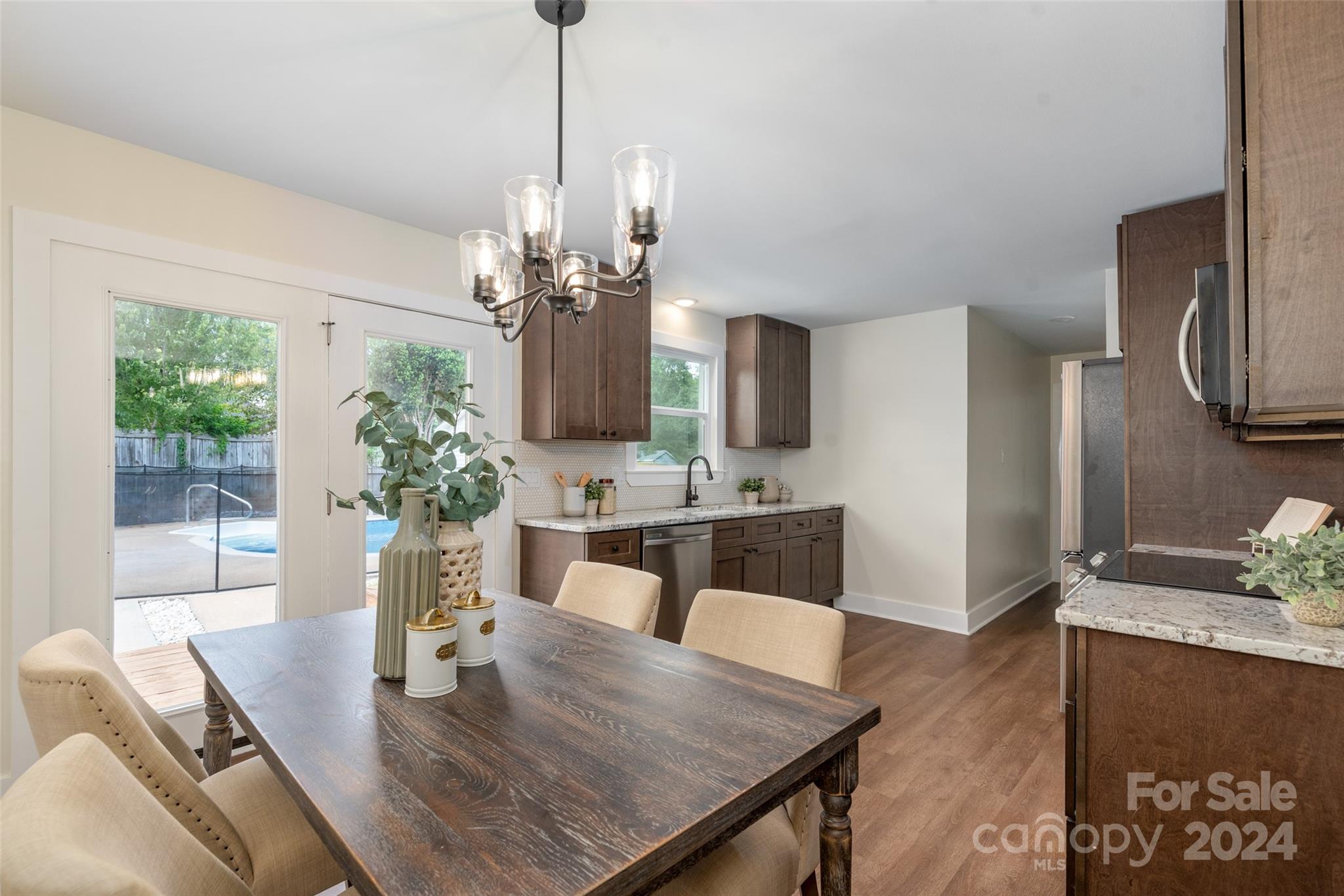 1660 Willowbrook Drive Fort Mill, SC 29708 - Photo 10 of 29 a view of a dining room with furniture and wooden floor