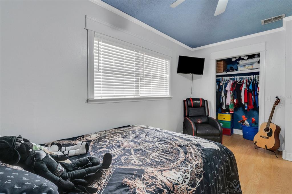 202 St Lucie Road Winter Haven, FL 33884 - Photo 12 of 32 a bedroom with a bed and a window