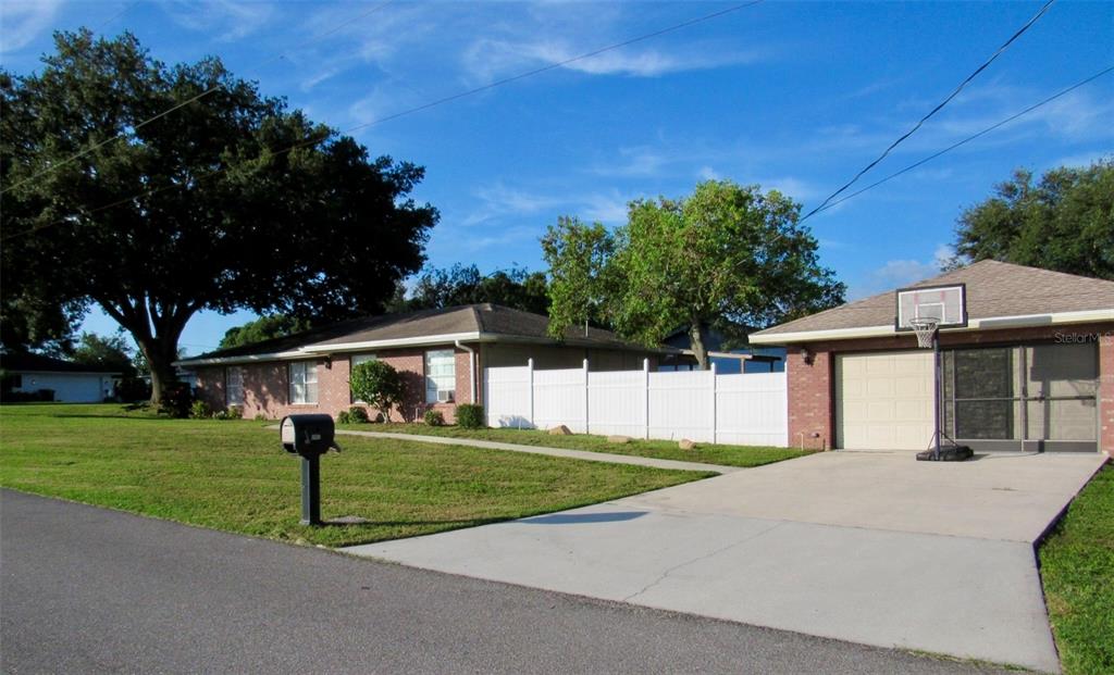 202 St Lucie Road Winter Haven, FL 33884 - Photo 32 of 32 a front view of a house with a yard