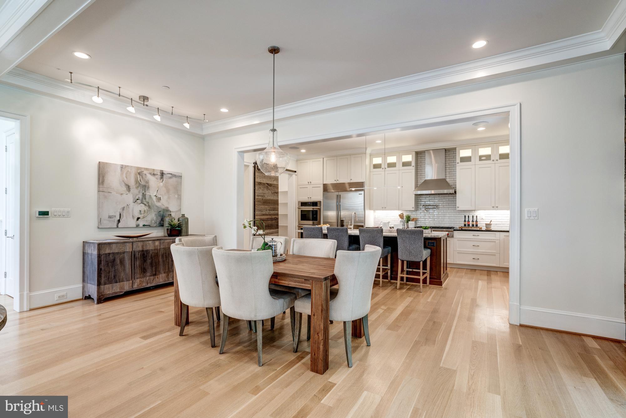 5607 Warwick Place Chevy Chase, MD 20815 - Photo 13 of 91 a view of a dining room with furniture window and wooden floor