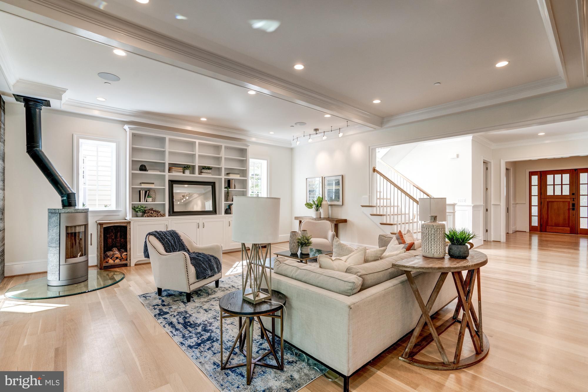 5607 Warwick Place Chevy Chase, MD 20815 - Photo 22 of 91 a living room with fireplace furniture and a wooden floor