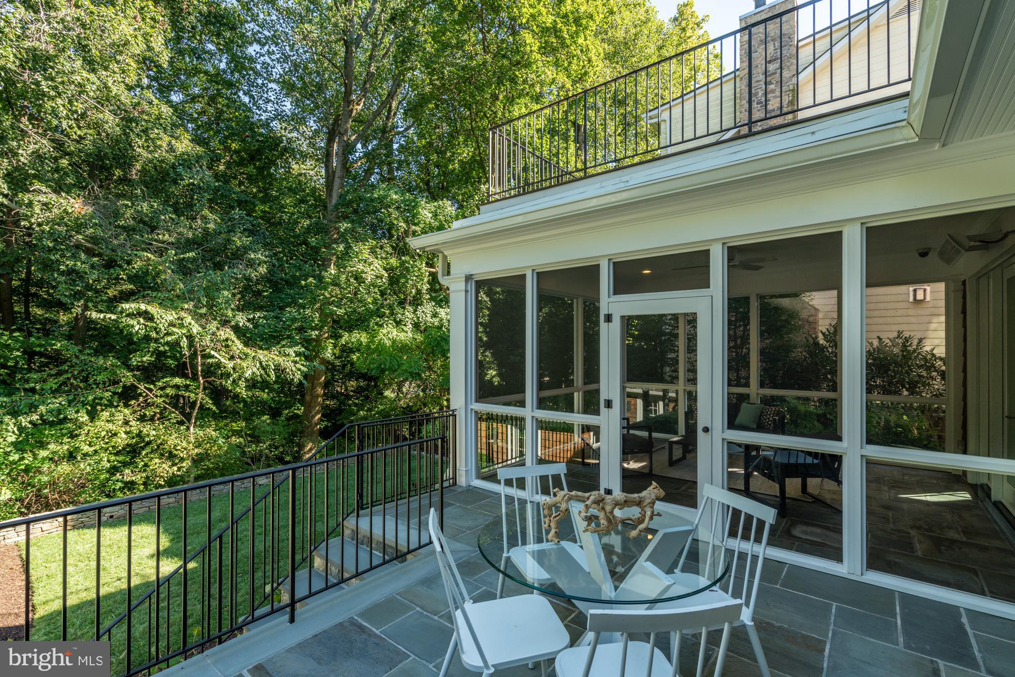 5607 Warwick Place Chevy Chase, MD 20815 - Photo 30 of 91 a view of a chair and table in the balcony