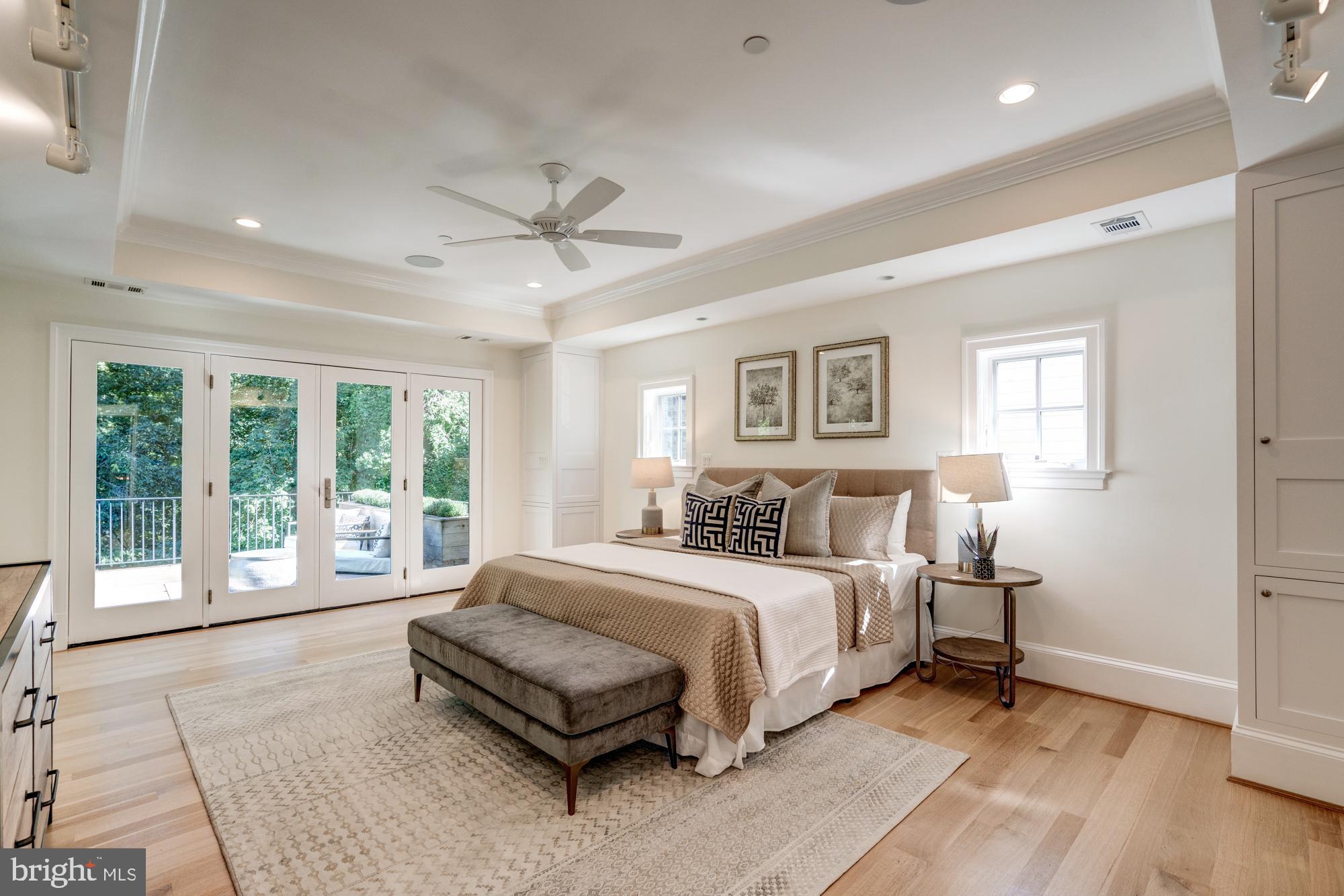 5607 Warwick Place Chevy Chase, MD 20815 - Photo 42 of 91 a spacious bedroom with a large bed and a large window