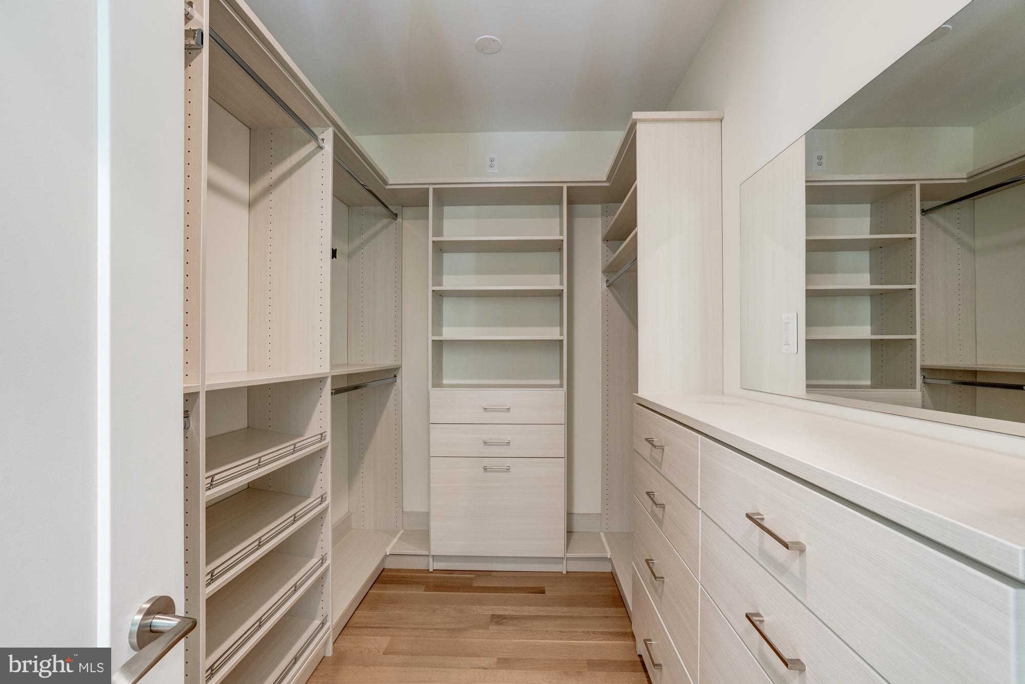 5607 Warwick Place Chevy Chase, MD 20815 - Photo 47 of 91 a view of walk in closet with empty racks