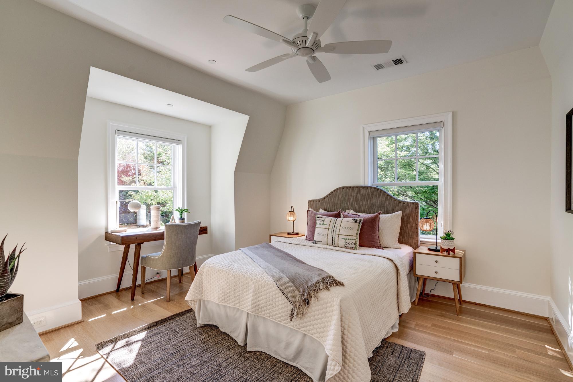 5607 Warwick Place Chevy Chase, MD 20815 - Photo 58 of 91 a bedroom with a large bed and a window