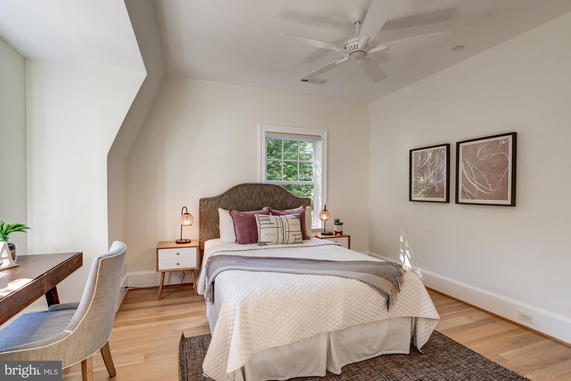 5607 Warwick Place Chevy Chase, MD 20815 - Photo 59 of 91 a bedroom with a bed and a chair