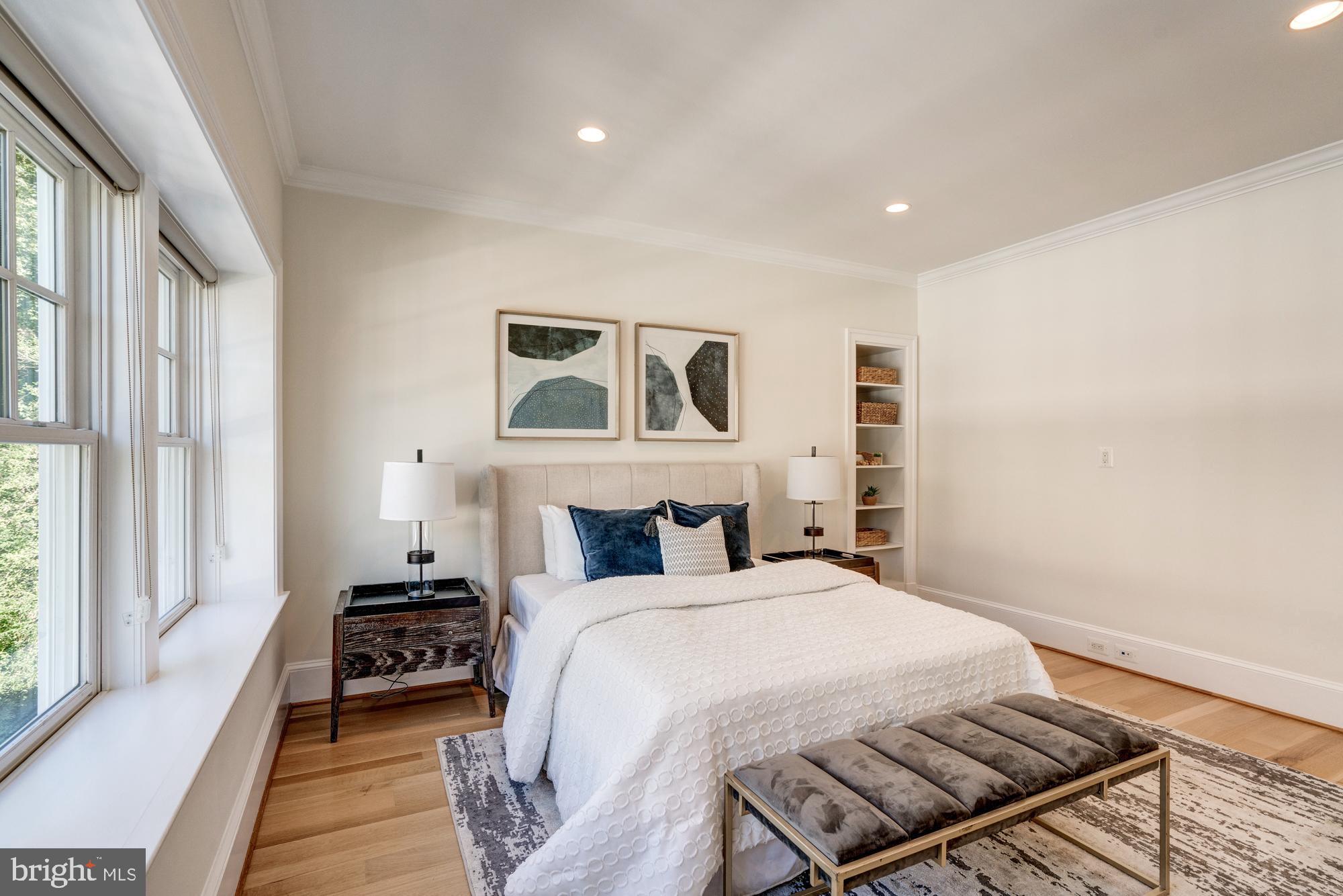 5607 Warwick Place Chevy Chase, MD 20815 - Photo 61 of 91 a bedroom with a bed and a large window with outer view