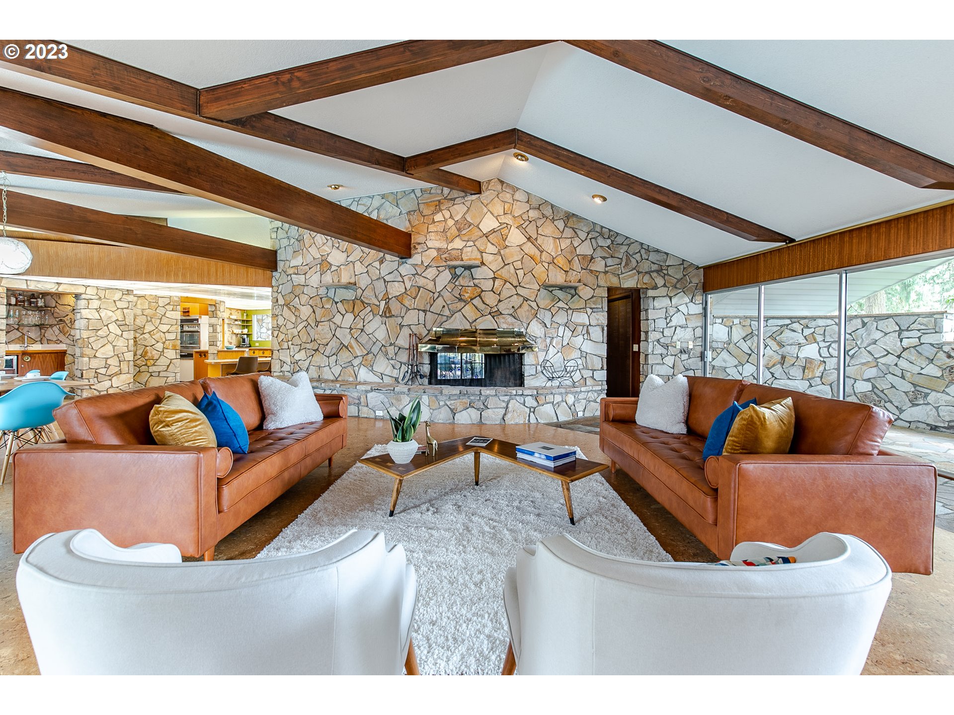 85124 Cloverdale Road Creswell, OR 97426 - Photo 11 of 48 a living room with furniture a fireplace and a large window