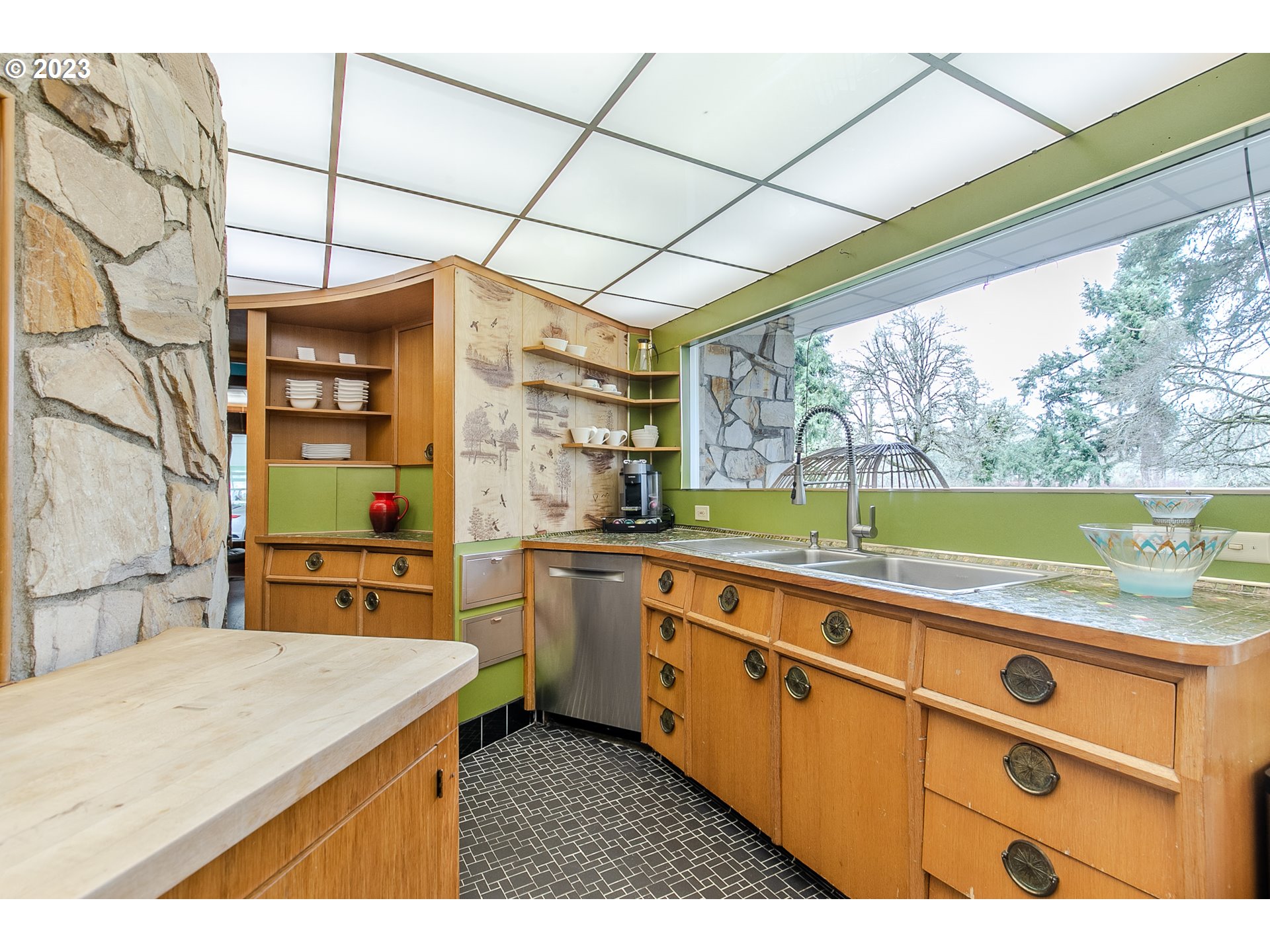 85124 Cloverdale Road Creswell, OR 97426 - Photo 19 of 48 a kitchen that has a sink a stove top oven a counter space and cabinets