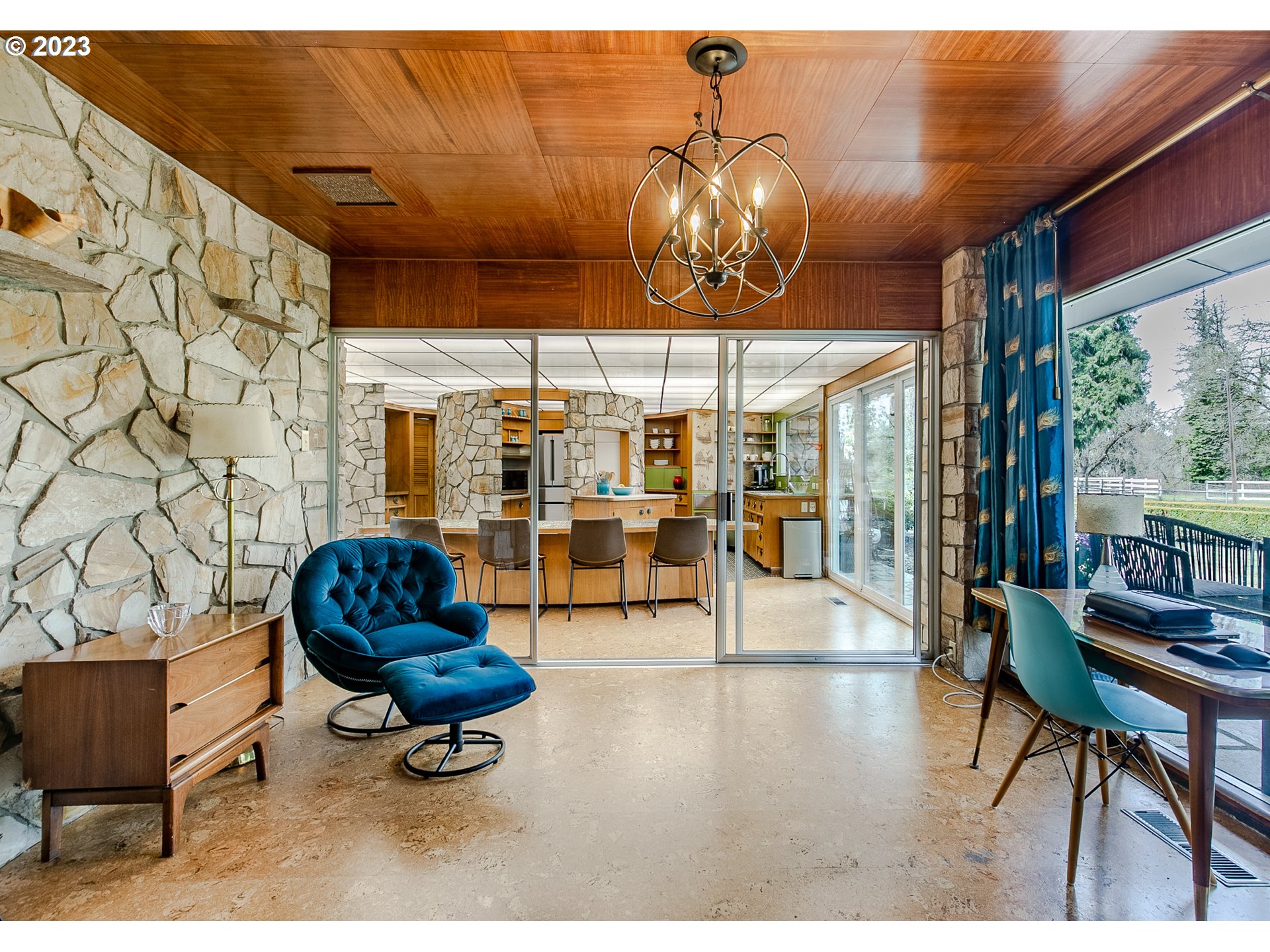 85124 Cloverdale Road Creswell, OR 97426 - Photo 21 of 48 a living room with patio furniture and a chandelier