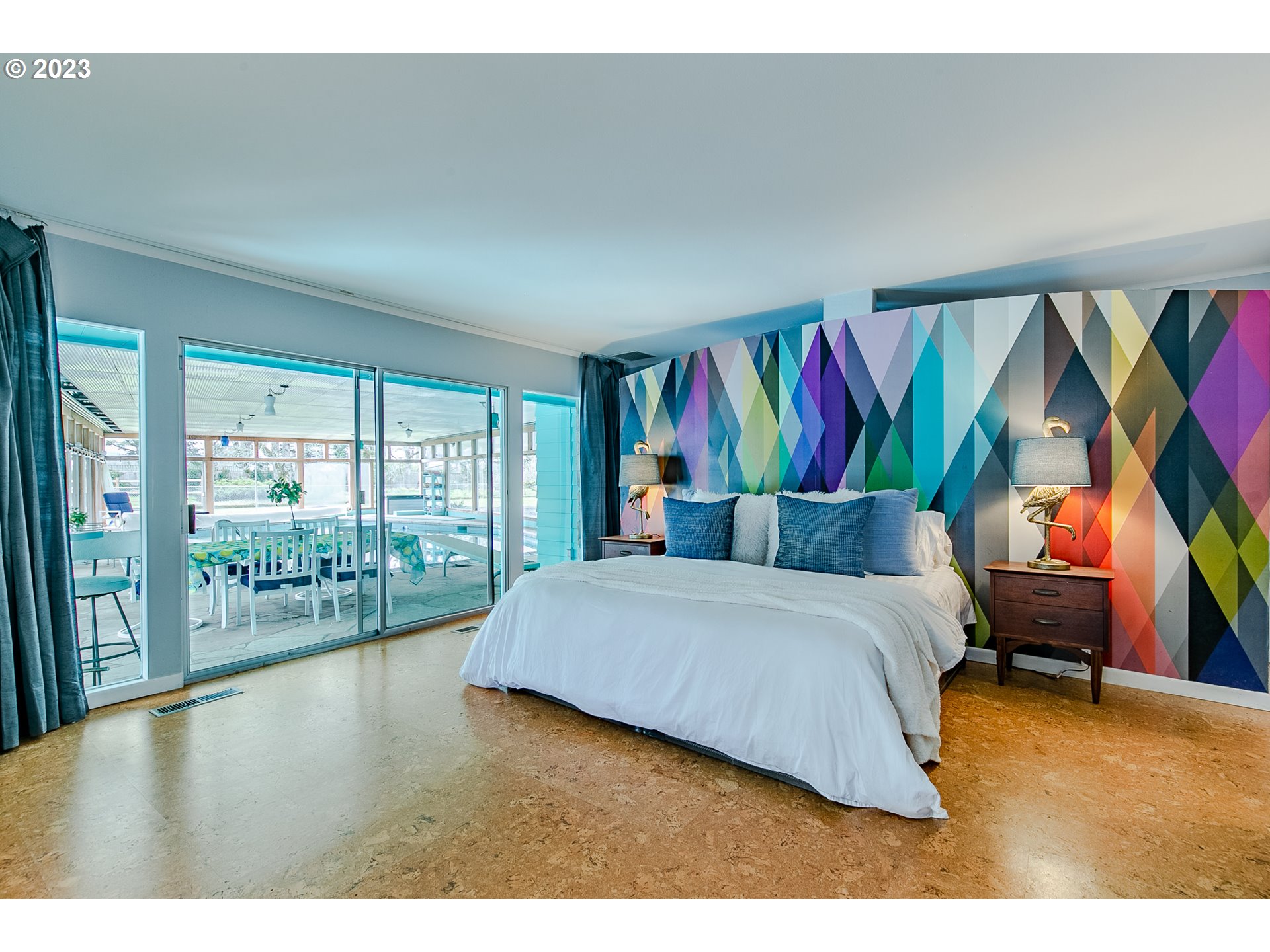 85124 Cloverdale Road Creswell, OR 97426 - Photo 23 of 48 a bedroom with a bed a couch and a large window