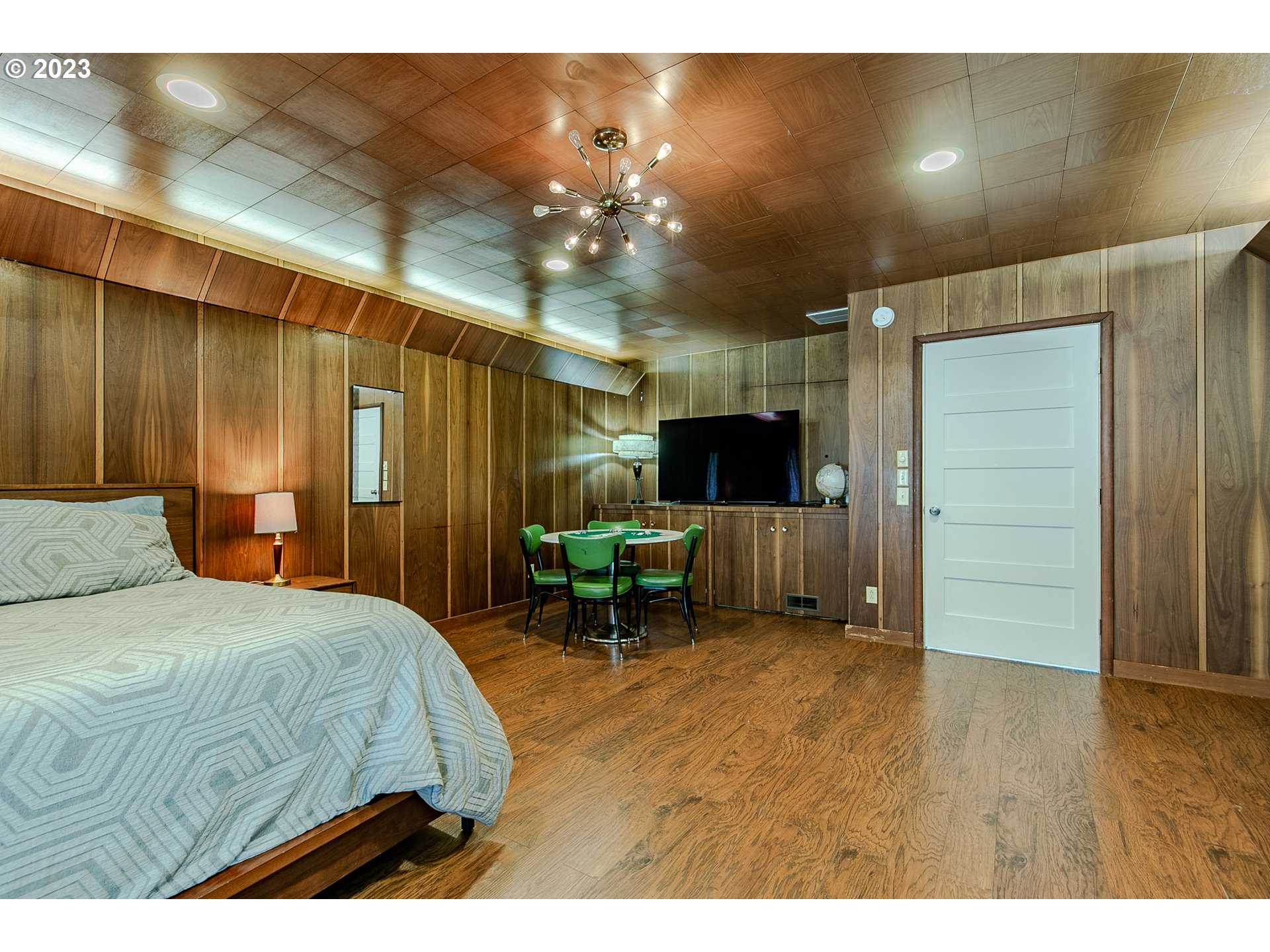 85124 Cloverdale Road Creswell, OR 97426 - Photo 29 of 48 a bedroom with a bed and a chandelier