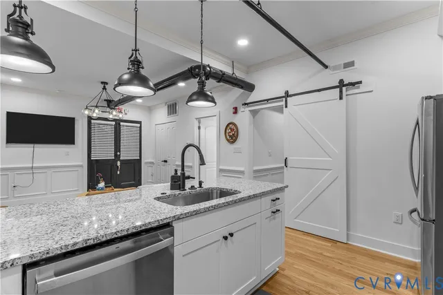 a bedroom with a bed and a lamp