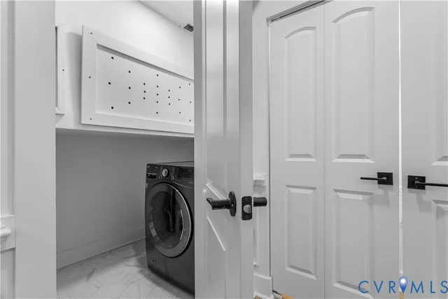 a bedroom with bed and a table