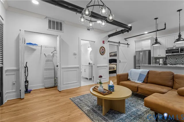 a bathroom with a granite countertop sink a mirror and a shower