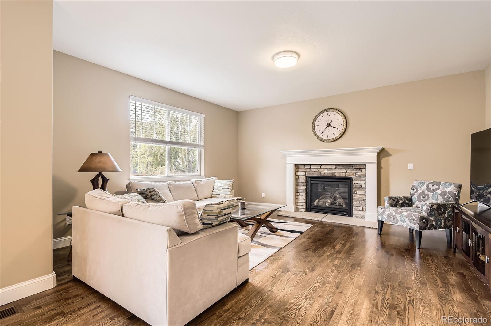 14110 Greenfield Loop Parker, CO 80134 - Photo 14 of 47 a living room with furniture and a fireplace