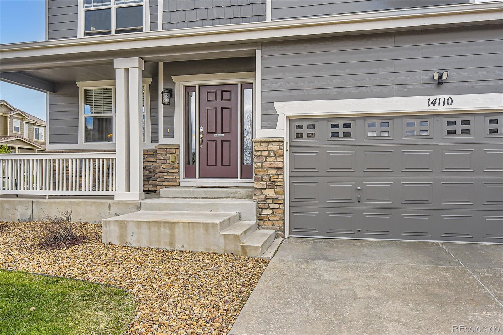 14110 Greenfield Loop Parker, CO 80134 - Photo 4 of 47 a view of a brick house with a door and a window