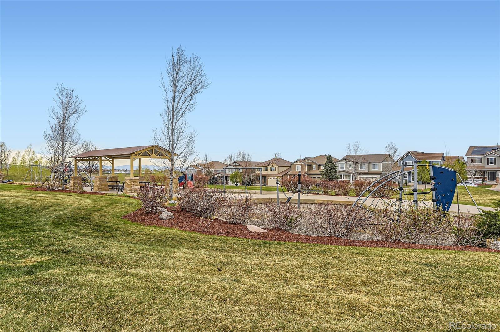 14110 Greenfield Loop Parker, CO 80134 - Photo 43 of 47 a view of a lake with houses