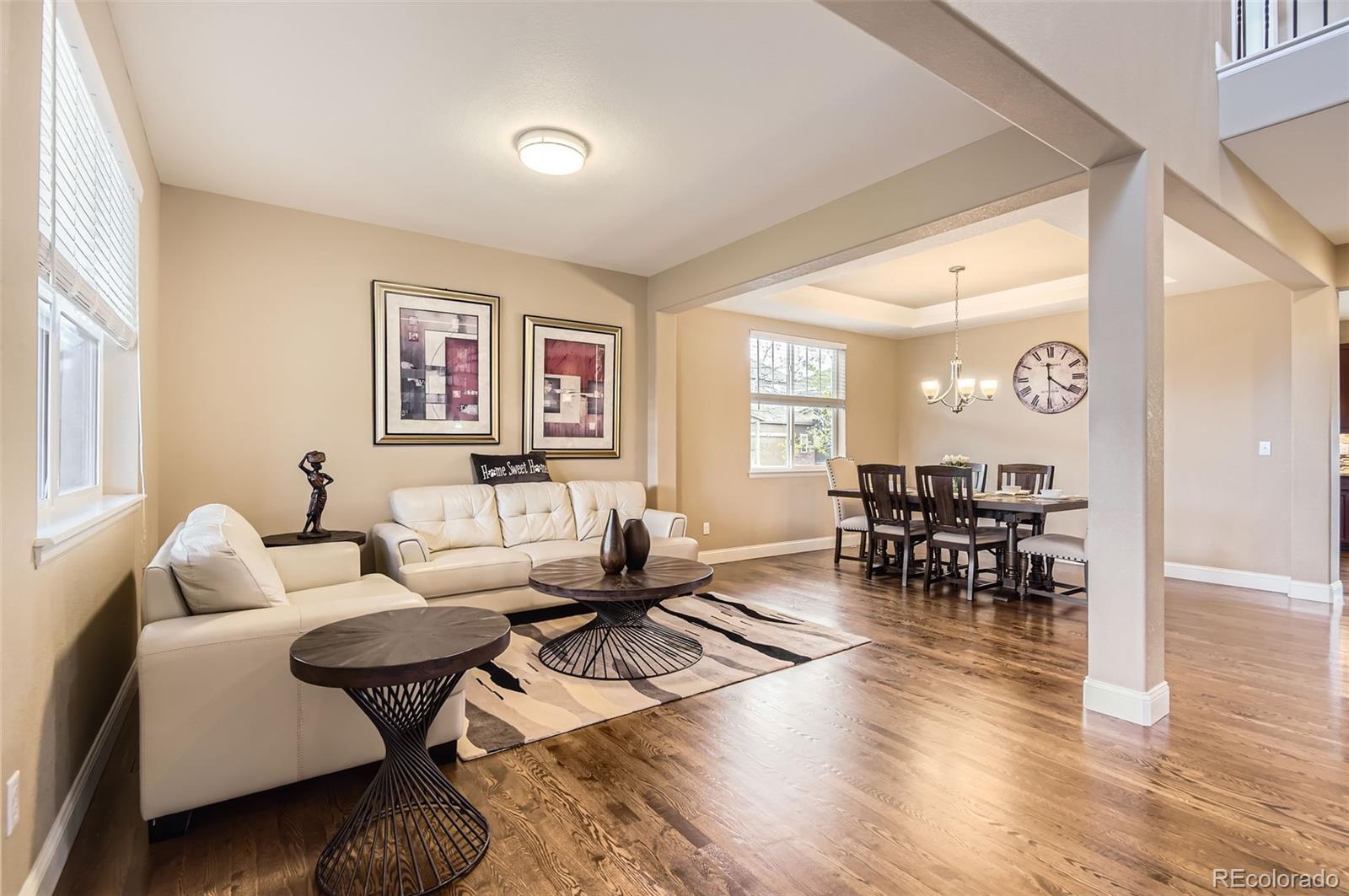 14110 Greenfield Loop Parker, CO 80134 - Photo 5 of 47 a living room with furniture and wooden floor