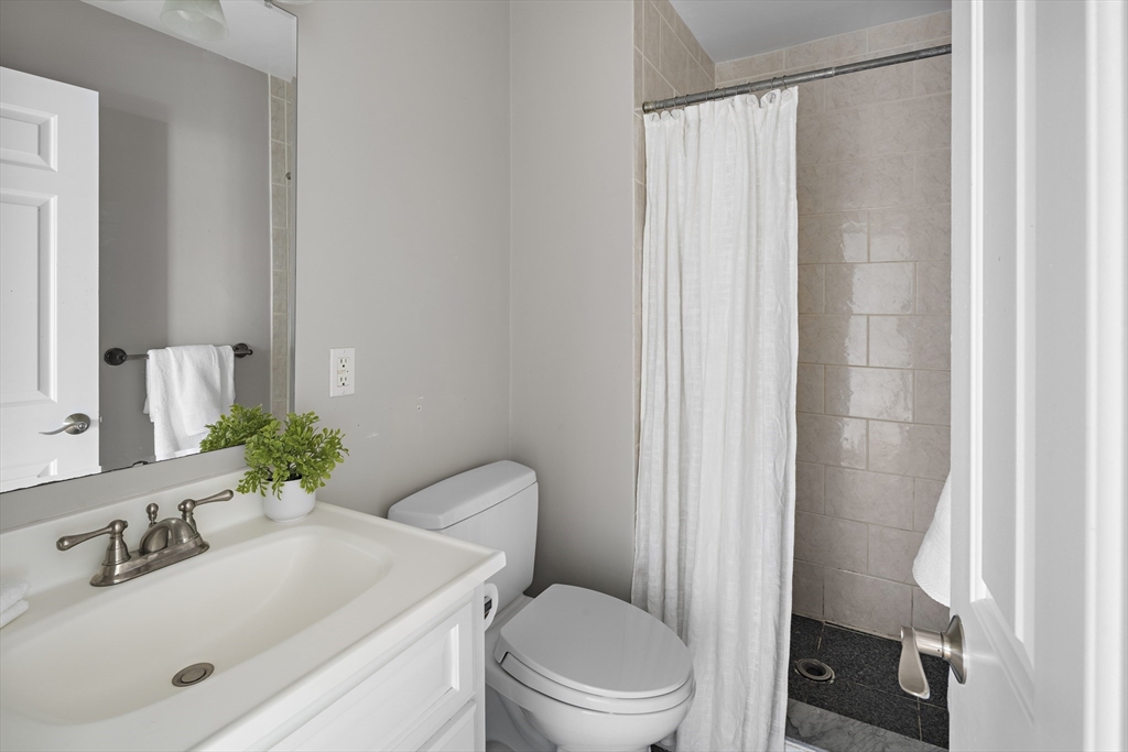 9 Cedar Street, Unit 2 Somerville, MA 02143 - Photo 16 of 20 a bathroom with a sink toilet and shower