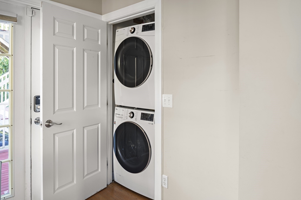9 Cedar Street, Unit 2 Somerville, MA 02143 - Photo 17 of 20 a view of a hallway with washer and dryer