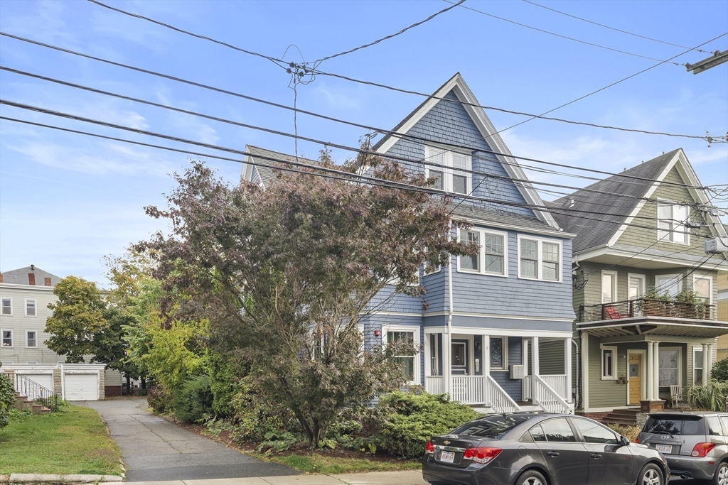 9 Cedar Street, Unit 2 Somerville, MA 02143 - Photo 19 of 20 a front view of a house with garden