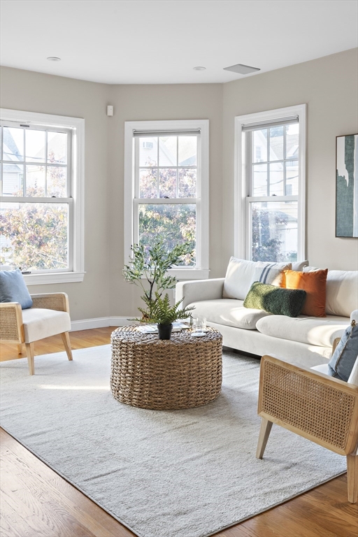 9 Cedar Street, Unit 2 Somerville, MA 02143 - Photo 2 of 20 a living room with furniture and a large window