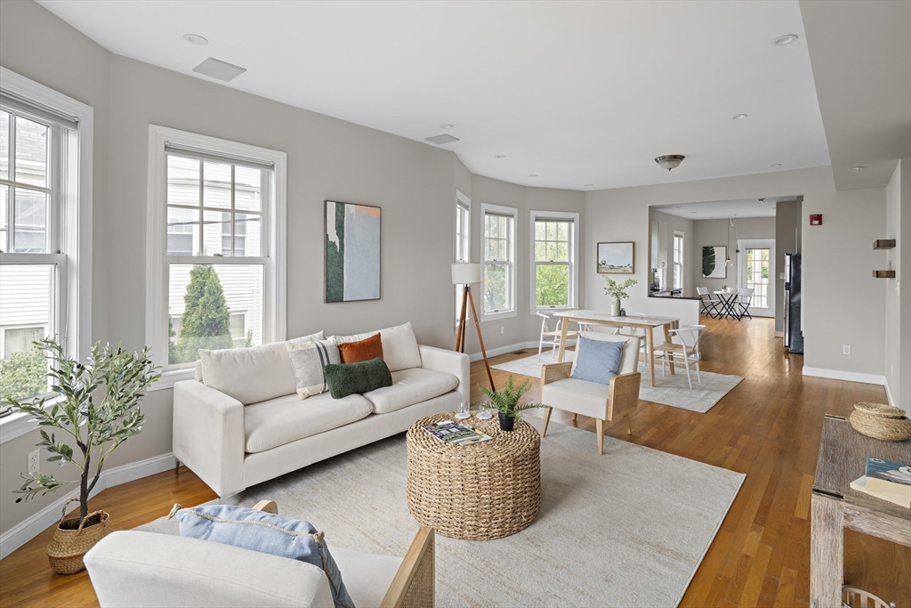 9 Cedar Street, Unit 2 Somerville, MA 02143 - Photo 4 of 20 a living room with furniture and a large window