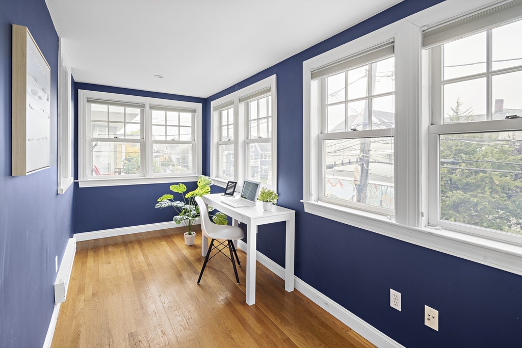 9 Cedar Street, Unit 2 Somerville, MA 02143 - Photo 5 of 20 a living room with furniture and a large window