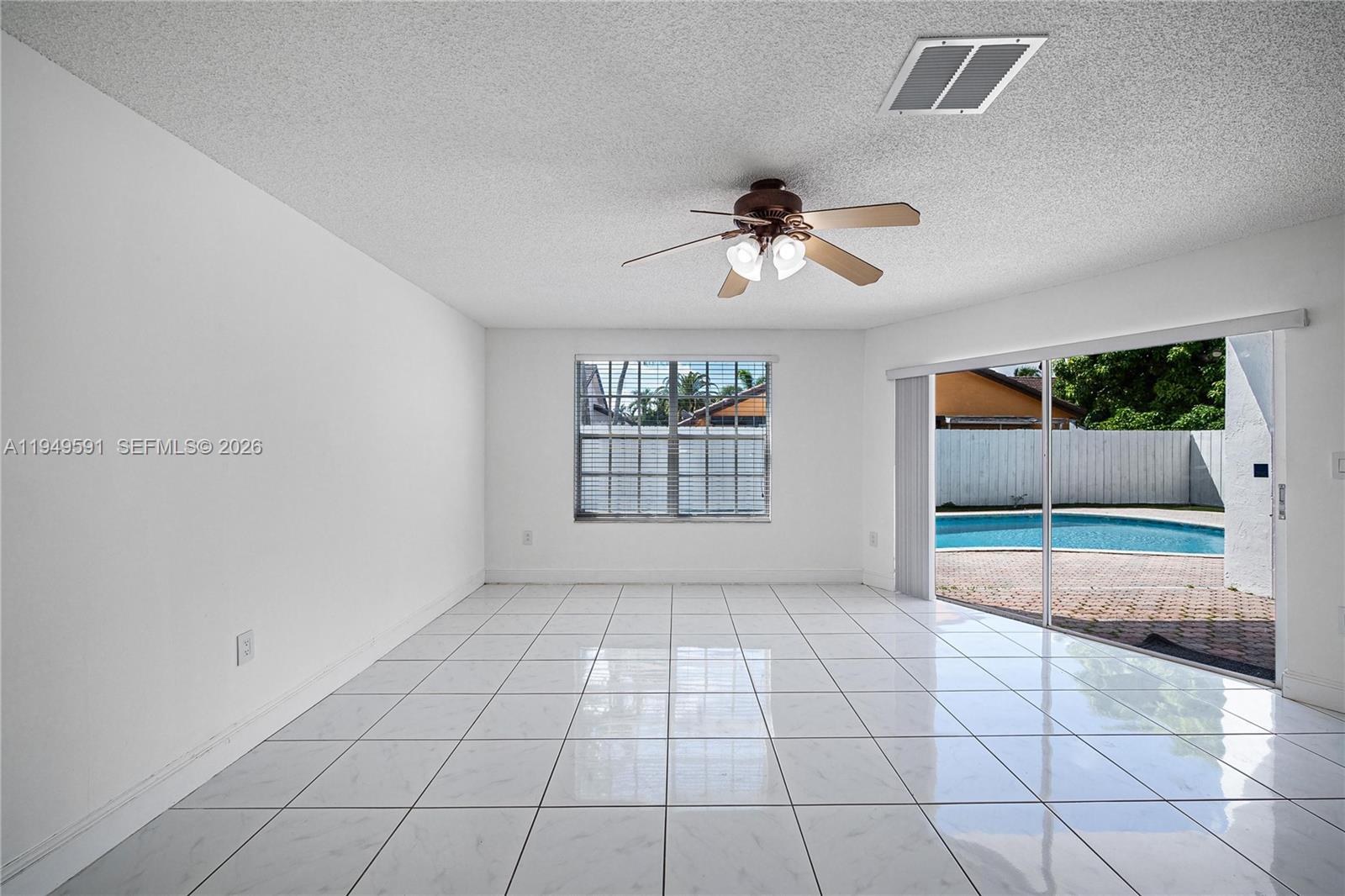 14340 Southwest 90th Street Miami, FL 33186 - Photo 17 of 34 a view of an empty room and window